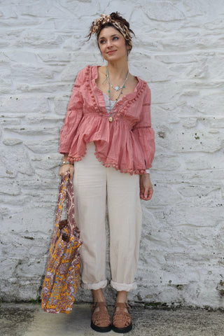 Pom pom detail tiered peach blouse