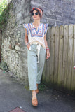 Sage green striped trousers