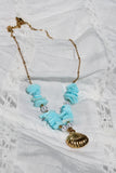 Gold clam shell and blue shell necklace