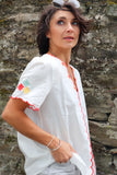 Red embroidered trim top