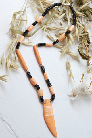 Orange beaded horn necklace