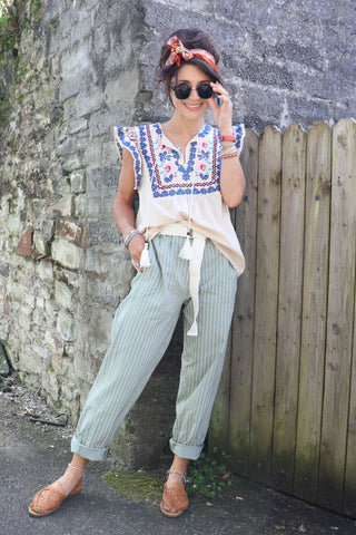 Sage green striped trousers
