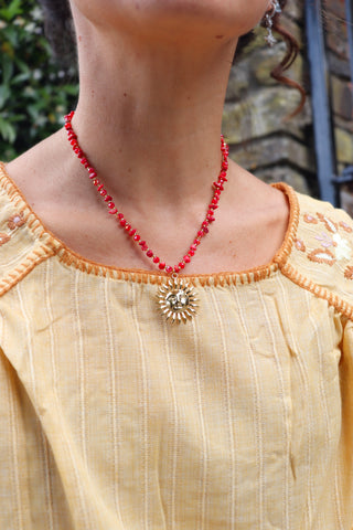 Gold sun and agate beaded necklace