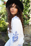 Blue embroidered button down blouse