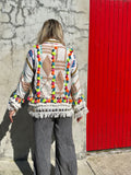 Embroidered jacket with multicoloured tassels