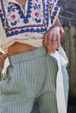 Sage green striped trousers