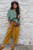 Turquoise border print blouse