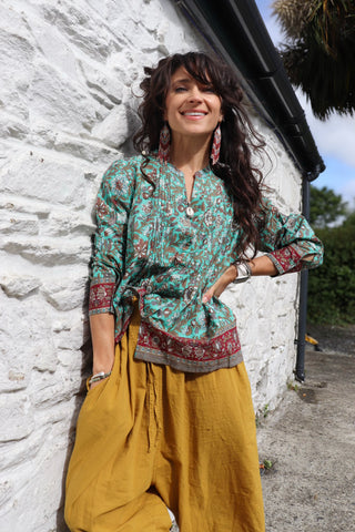 Turquoise border print blouse