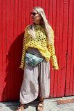 Yellow open-knit crochet top