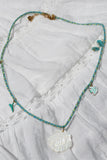 whale tail and shell beaded necklace
