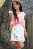 Floral embroidered linen shorts