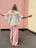 Scalloped floral crochet top