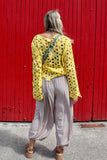 Yellow open-knit crochet top