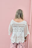 Scalloped floral crochet top