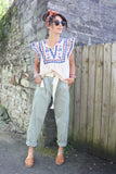 Sage green striped trousers