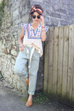 Sage green striped trousers