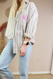 Striped shirt with embroidered flower